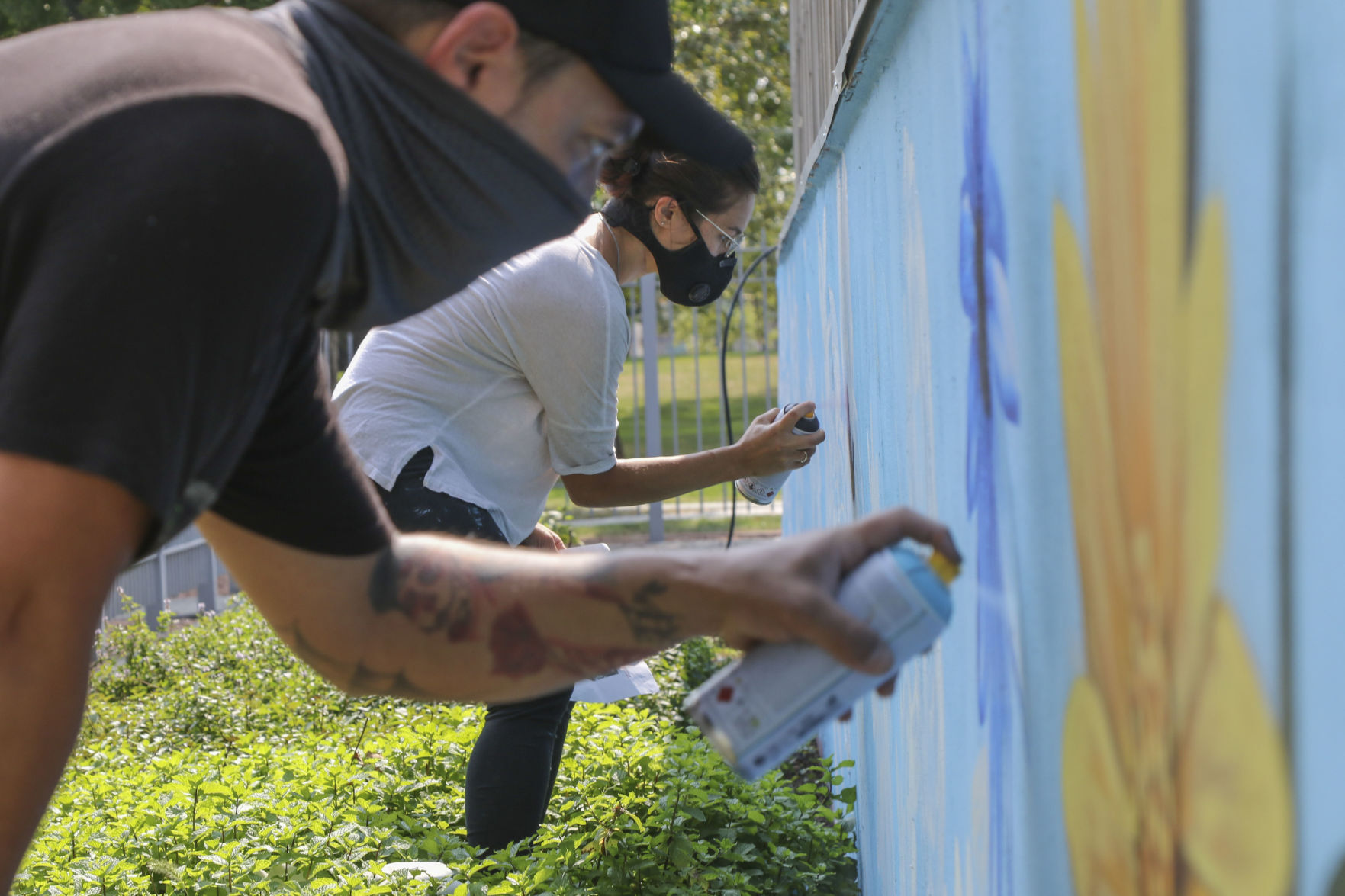 Artist Felix Maldonado paints mural